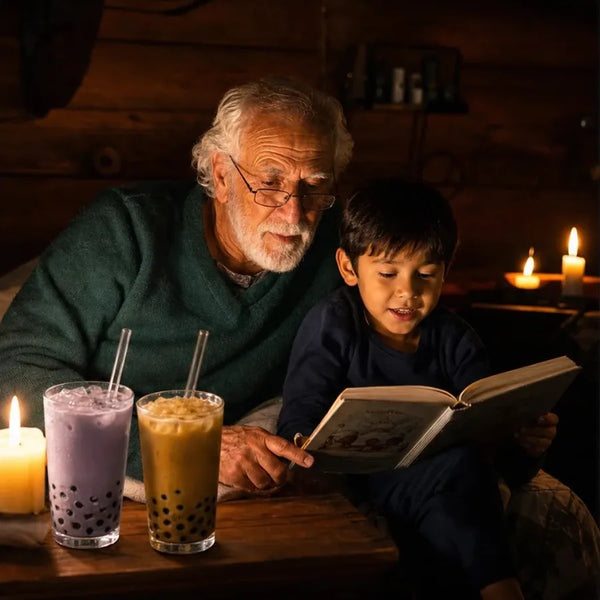 Grandpa and grandson reading by candlelight with boba