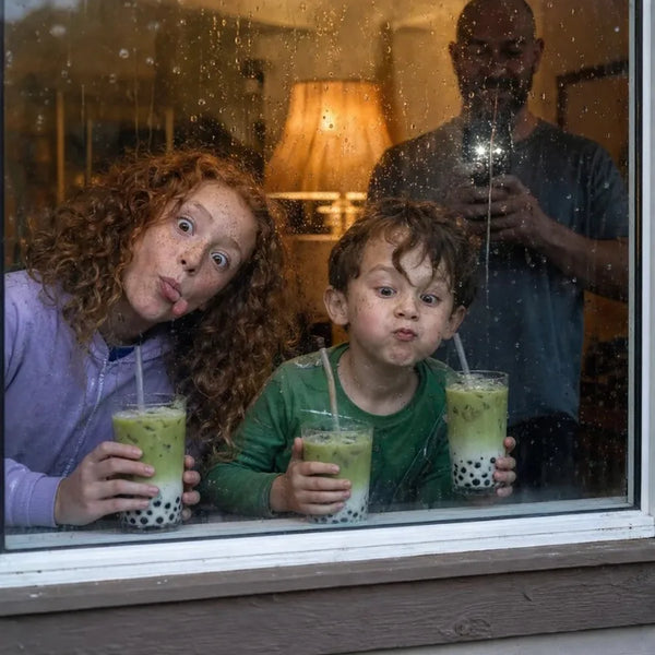 Kids making funny faces at a rainy window with matcha boba