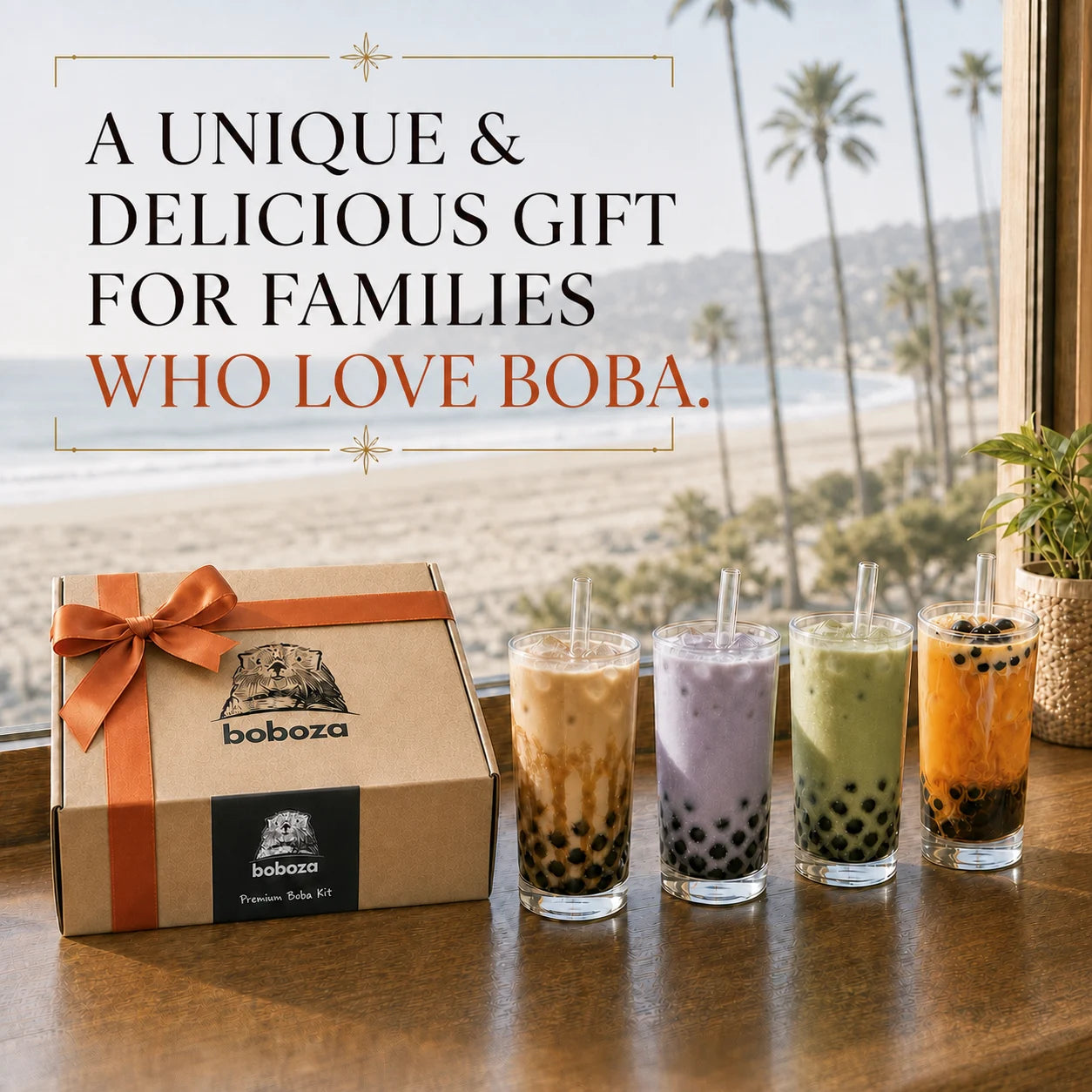 Boboza premium boba kit gift box with orange ribbon next to four finished boba drinks by a beach window, with the headline A unique and delicious gift for families who love boba