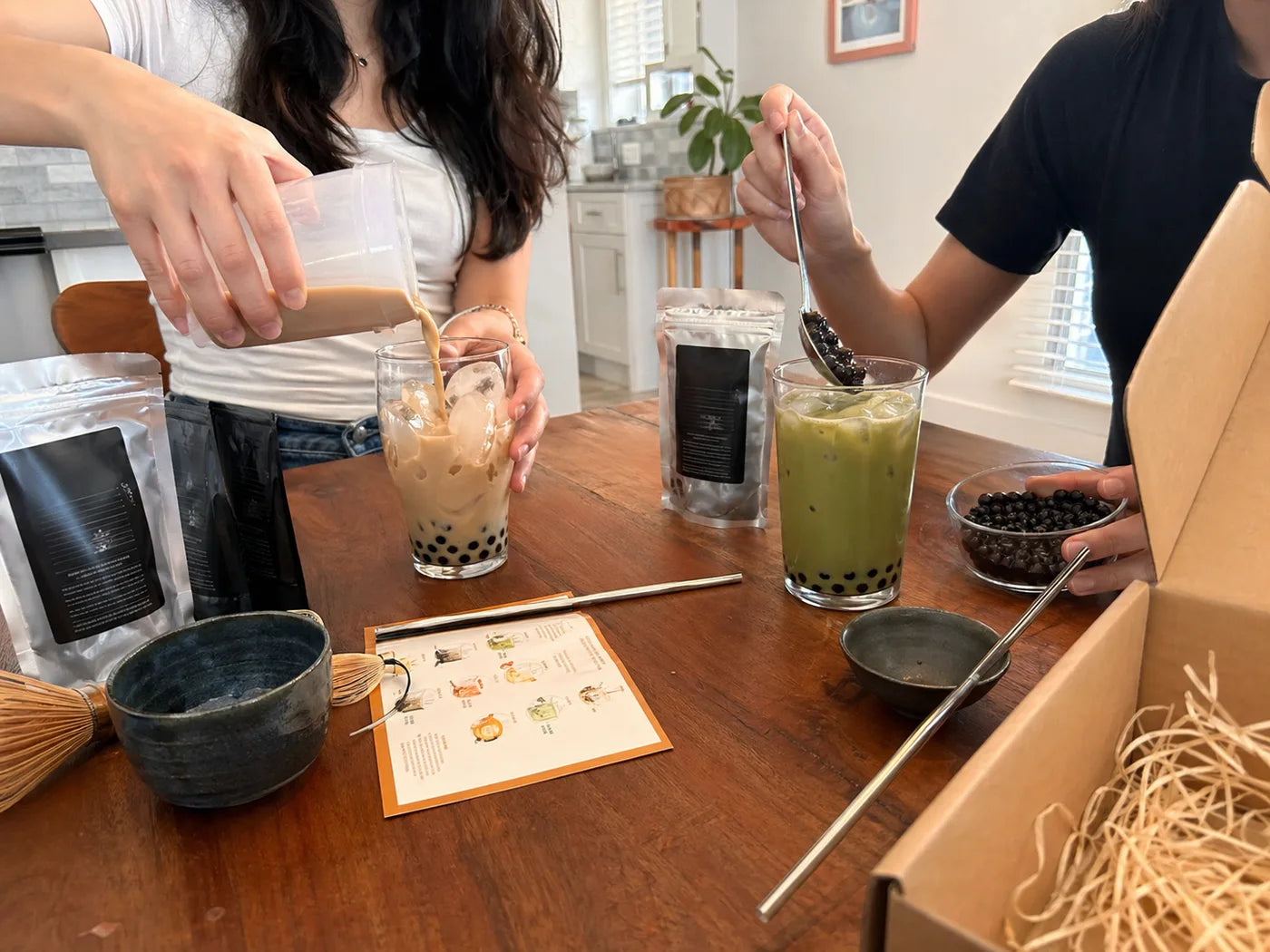 Friends making Boboza drinks at home