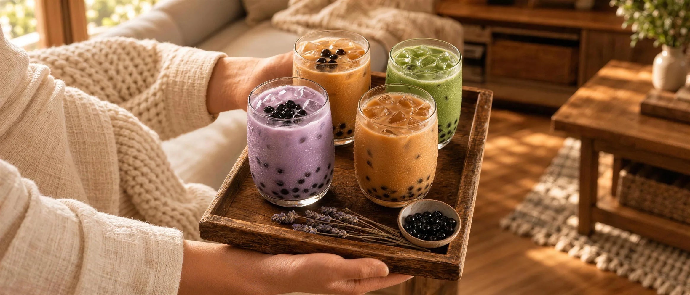 Milk tea poured over ice and boba pearls